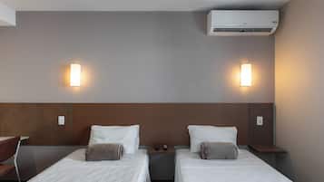 Standard Twin Room | Minibar, in-room safe, desk, laptop workspace