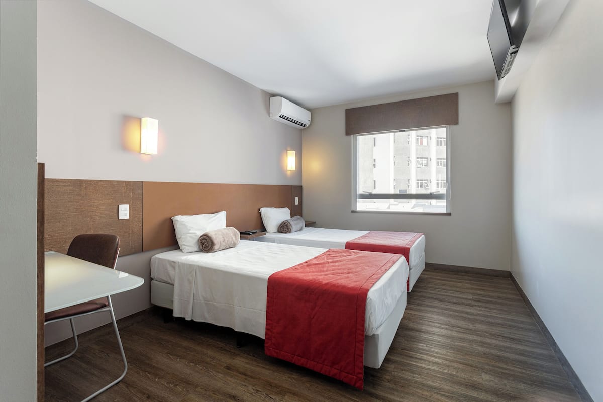 Standard Twin Room | Minibar, in-room safe, desk, laptop workspace