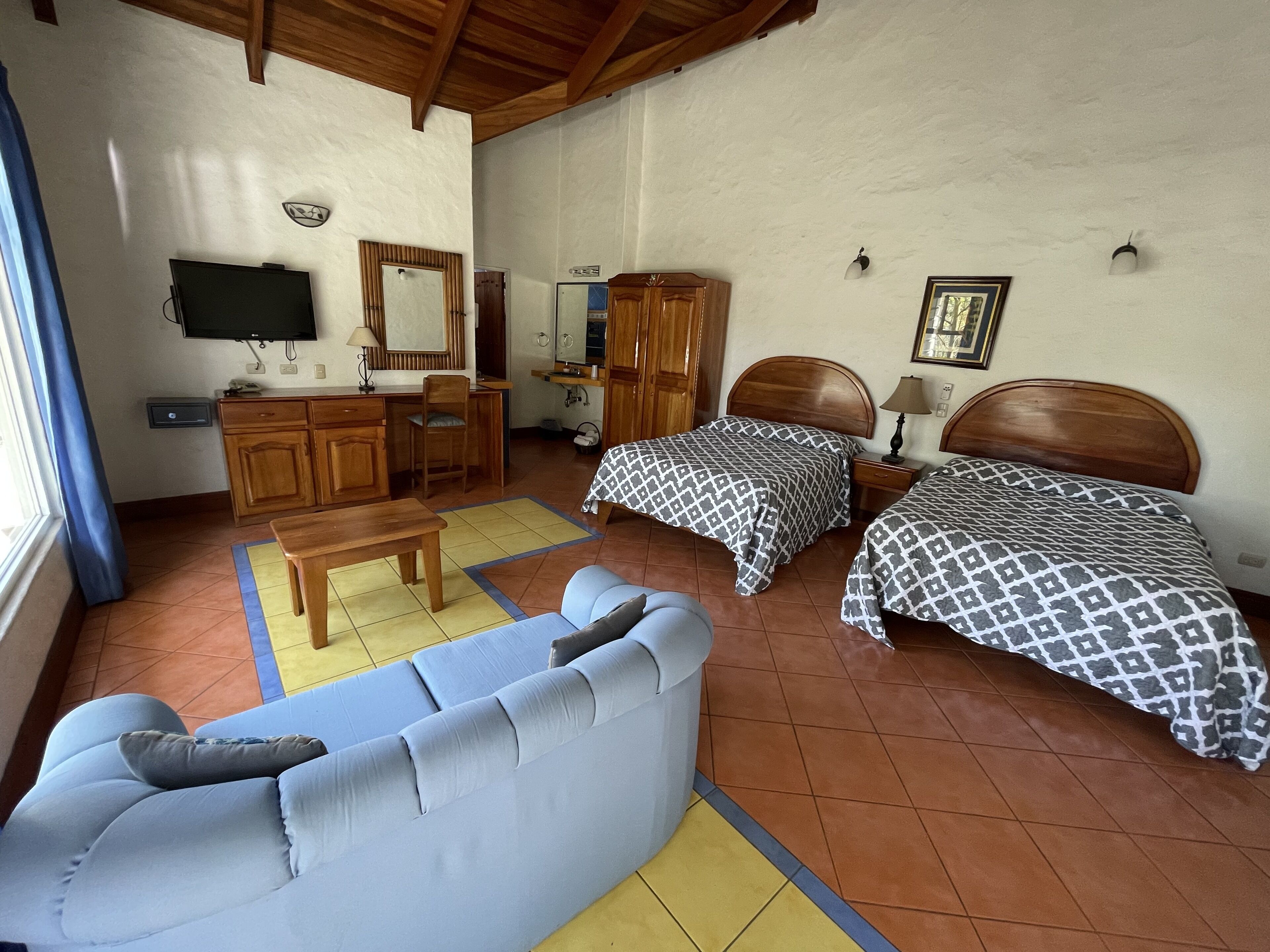 superior room, 2 double beds, private bathroom | in-room safe, individually decorated, individually furnished, desk