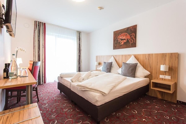 Premium bedding, desk, blackout curtains, soundproofing