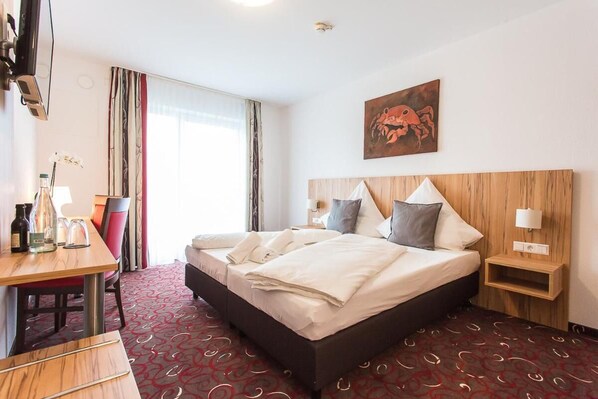 Premium bedding, desk, blackout curtains, soundproofing