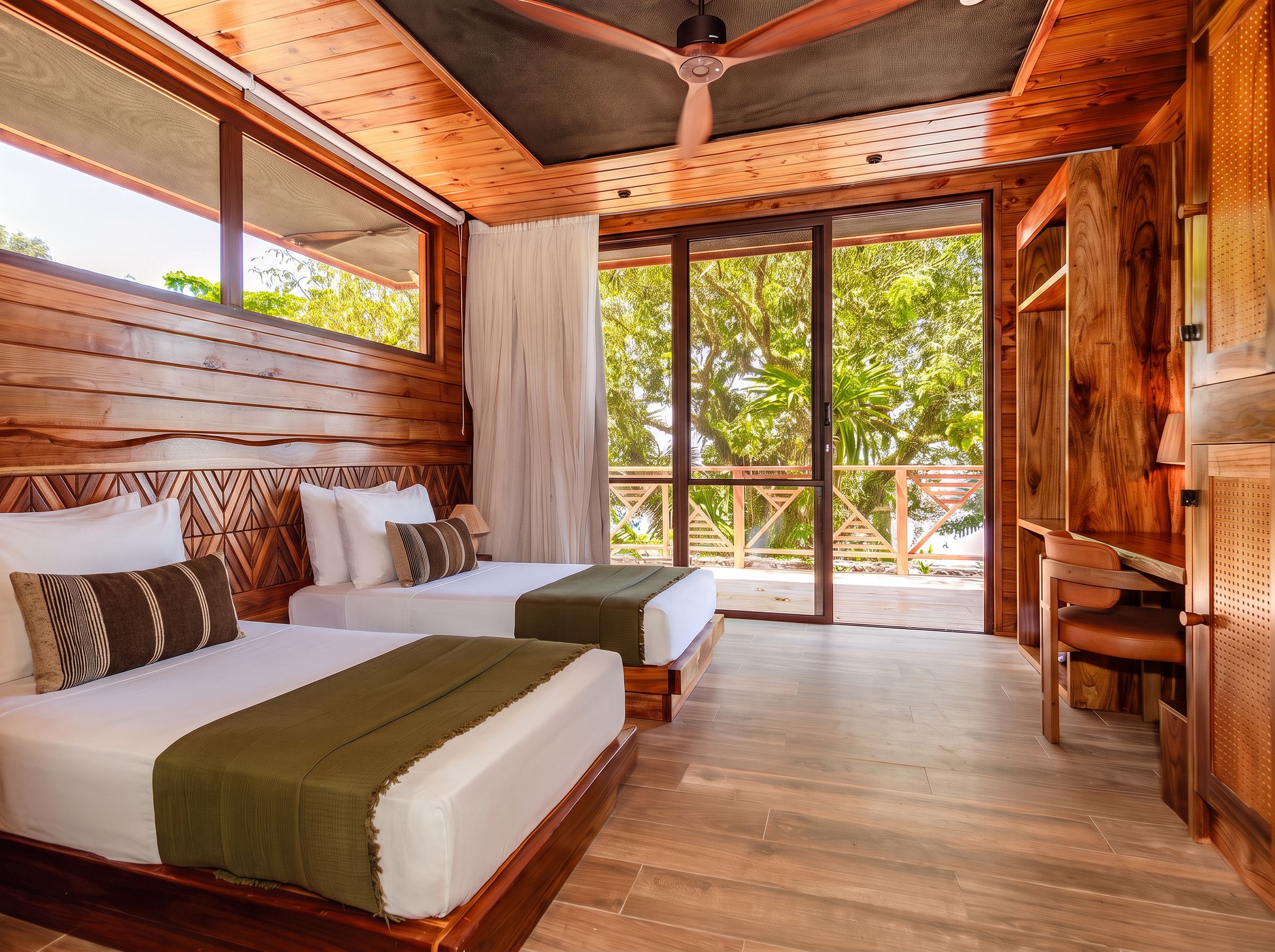 A hotel room with two beds, a wooden ceiling, and a view of greenery outside.