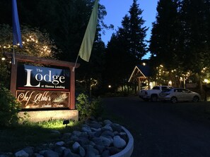 A sign for The Lodge at Skeena Landing, highlighting Chef Abhi's Classic Indian Cuisine.