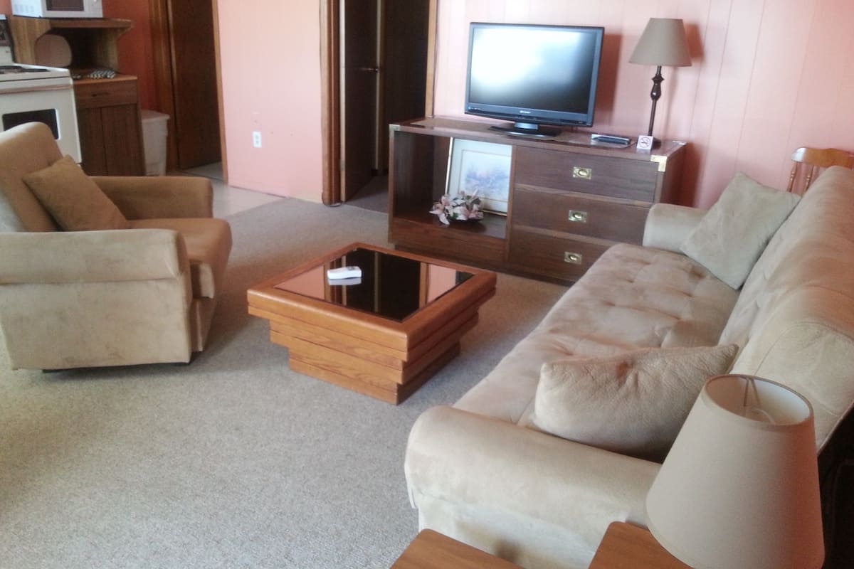 Suite, 1 Queen Bed with Sofa bed | Living area | 30-inch TV with satellite channels