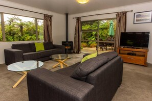 Three Bedroom House | Living room | Flat-screen TV, fireplace - Franz Josef Treetops (Franz Josef Glacier)
