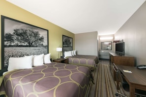 A hotel room with two beds, a desk, a television, and a bathroom visible in the background. - Super 8 by Wyndham Colorado City (Colorado City)
