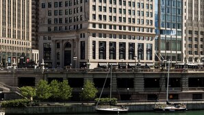 A historic building with a classical facade, large windows, and a prominent dome. - LondonHouse Chicago, Curio Collection by Hilton (Chicago)