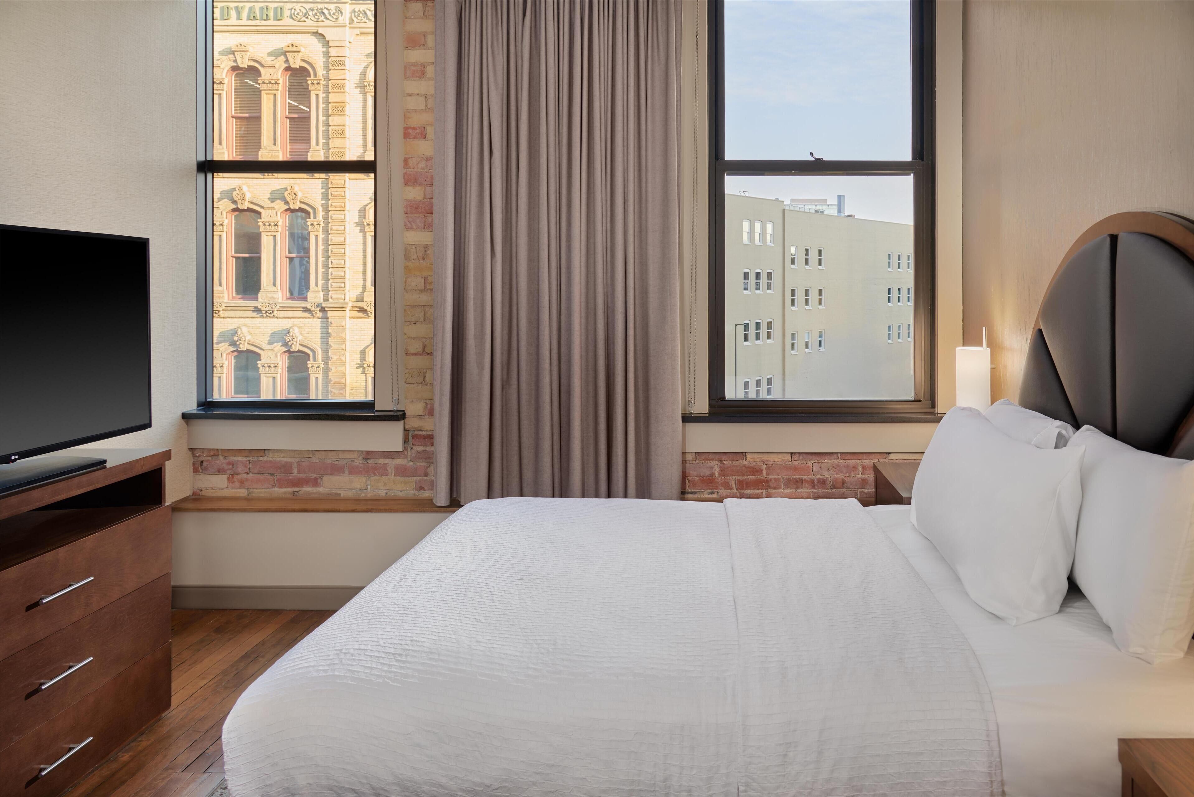 suite, 1 queen bed, non smoking, city view | in-room safe, desk, blackout curtains, iron/ironing board