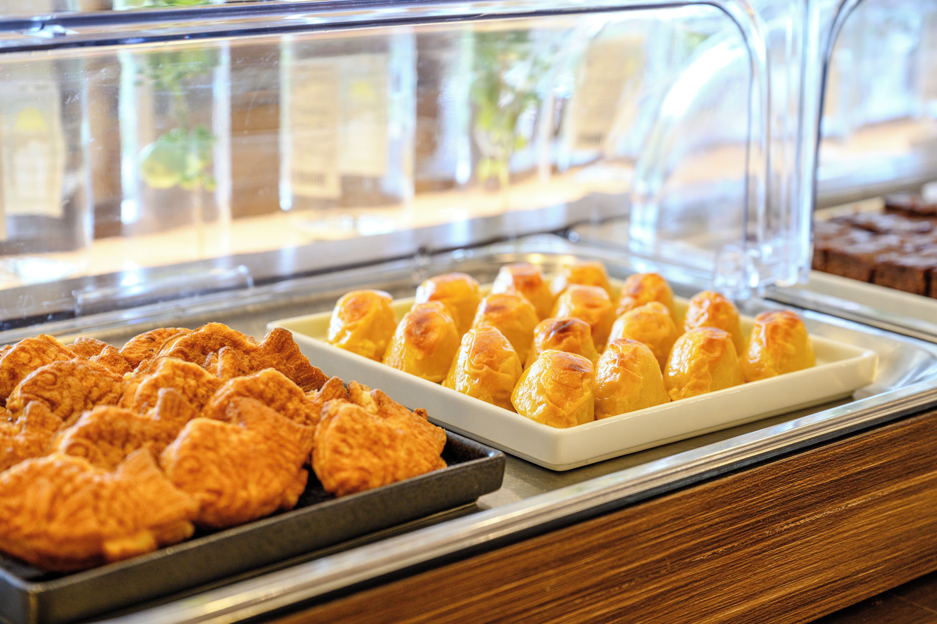 A bakery display case with pastries.