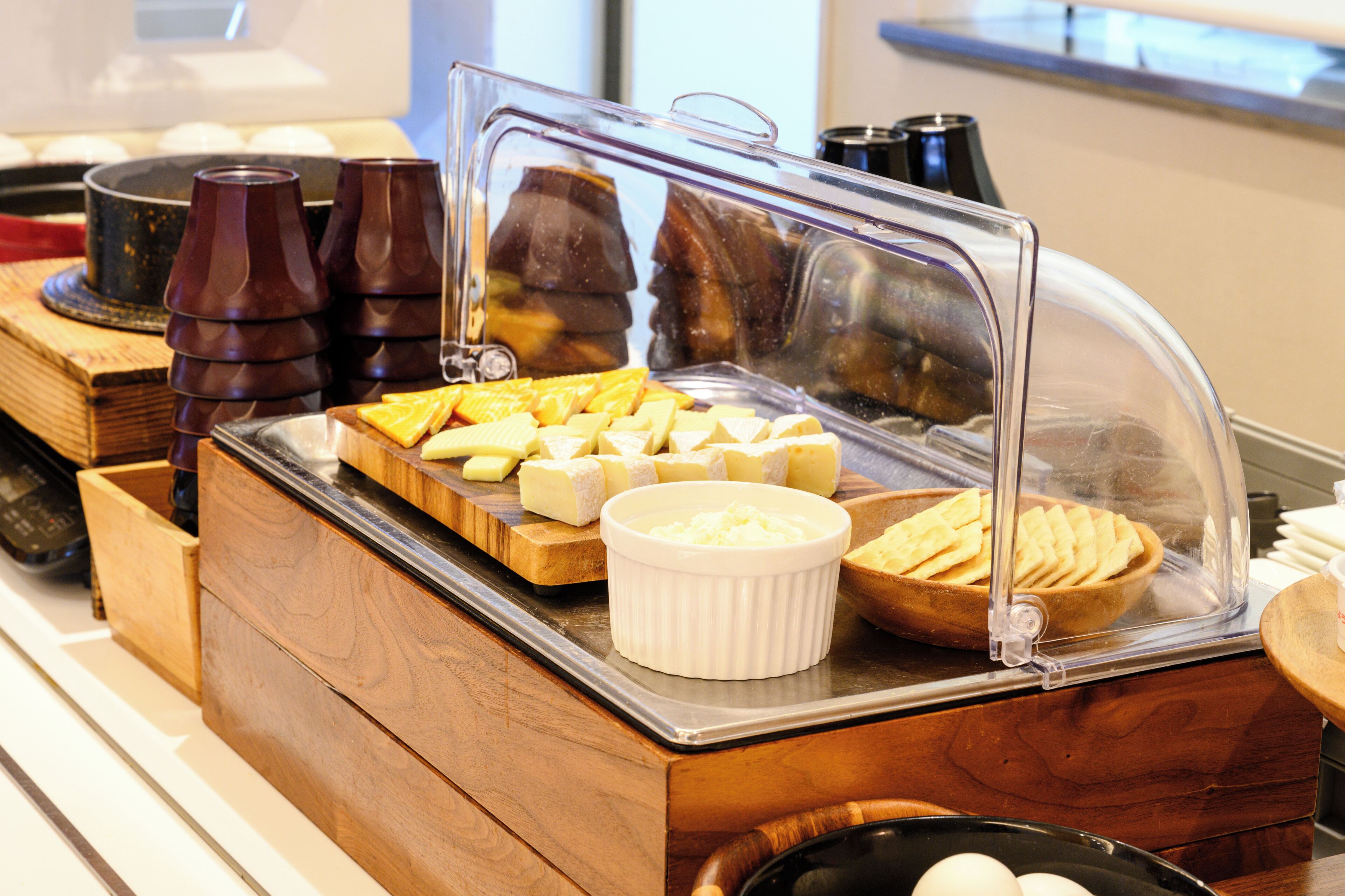 A breakfast buffet with various food items and condiments.