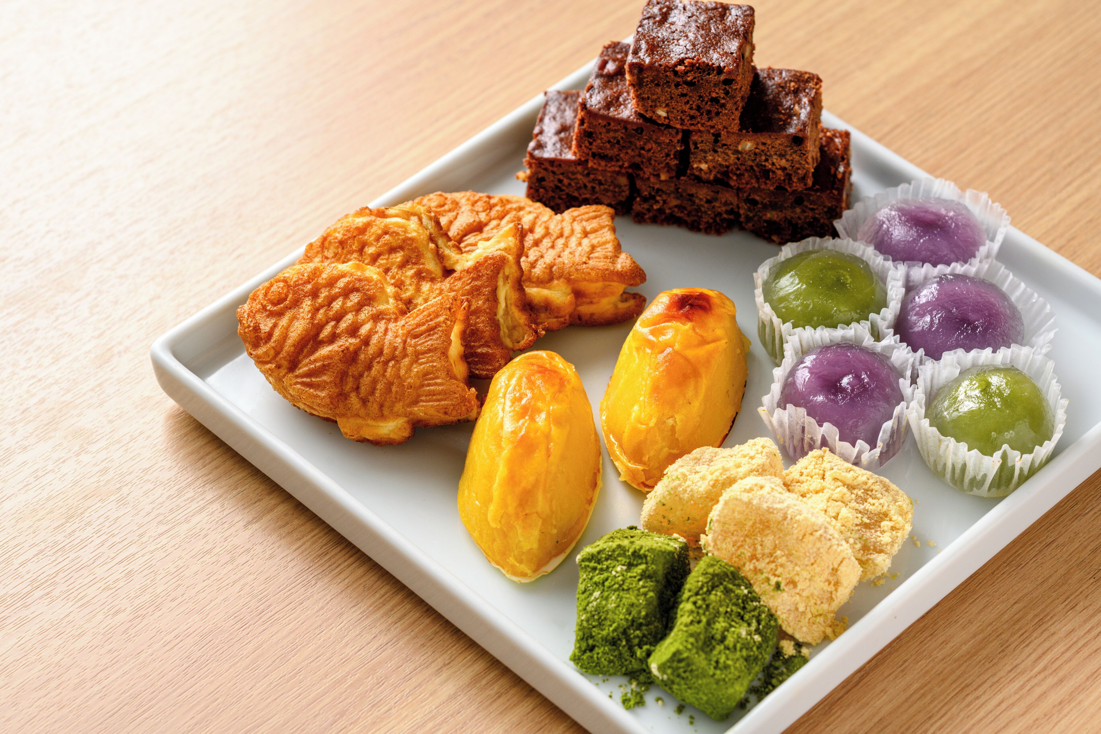 A plate of assorted pastries and desserts.