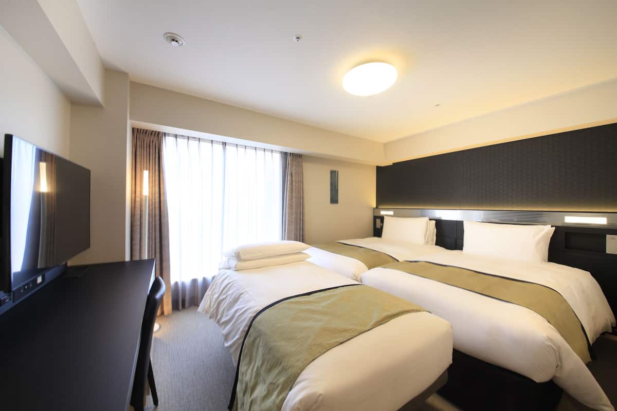 Premium bedding, down duvets, in-room safe, desk