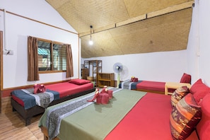 A room with two beds, a fan, and a window with curtains. - Family Song Koh Lipe (Koh Lipe)