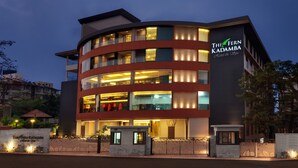 A modern hotel with multiple floors and balconies, featuring a prominent sign for The Fern Kadamba Hotel & Spa. - The Fern Kadamba Hotel & Spa Goa, Panjim, Series by Marriott (Panaji)