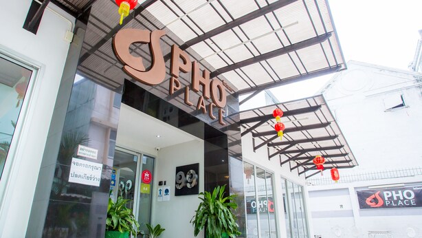 A storefront with a large sign reading "PHO PLACE". - Pho Place (Bangkok)