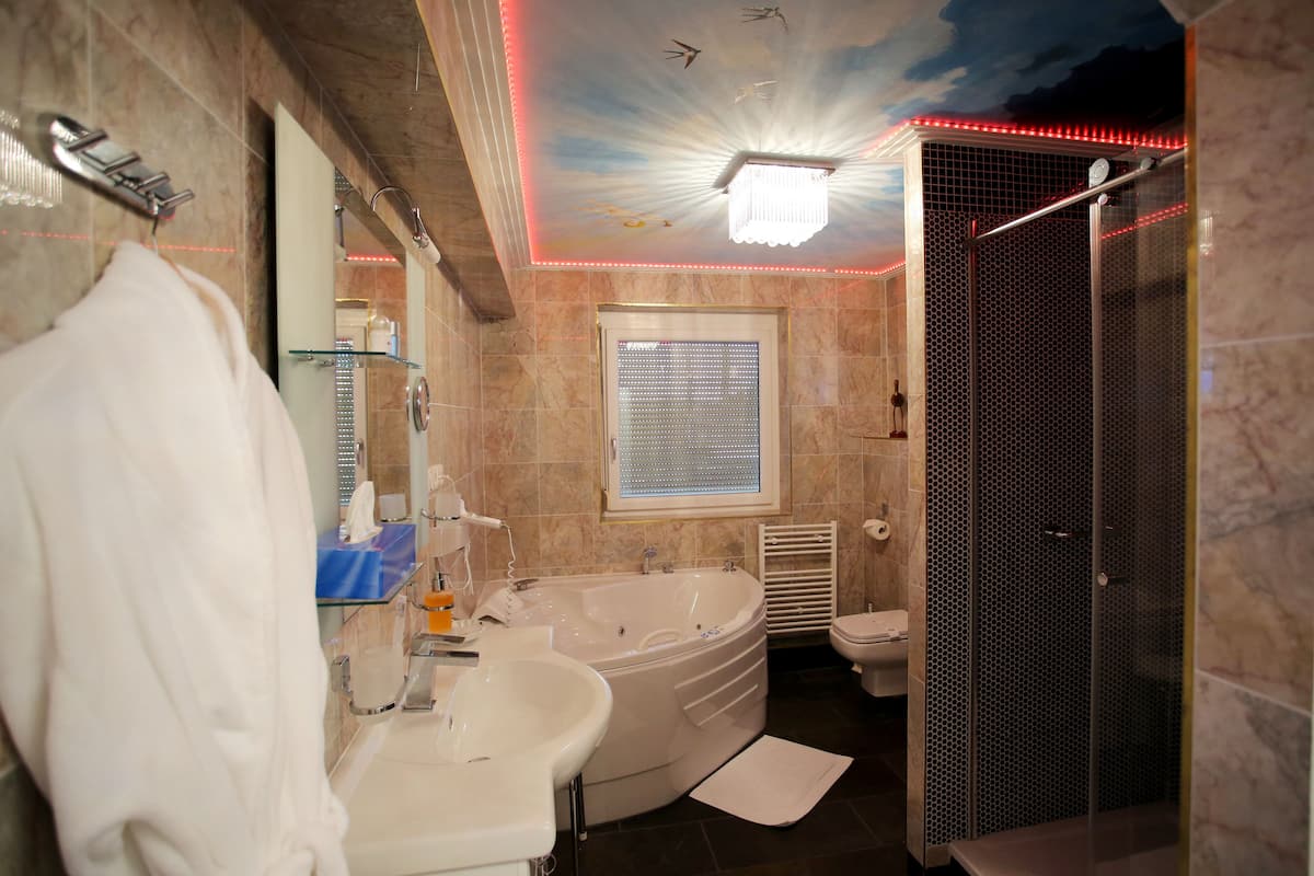 suite | bathroom amenities | free toiletries, hair dryer, bathrobes, slippers