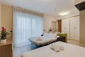 Premium bedding, desk, laptop workspace, iron/ironing board