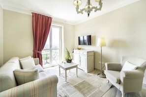 Suite, 1 King Bed, Balcony, Hill View | Living area | Flat-screen TV