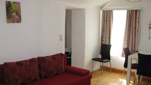 Apartment, 1 Bedroom | Living room | Flat-screen TV