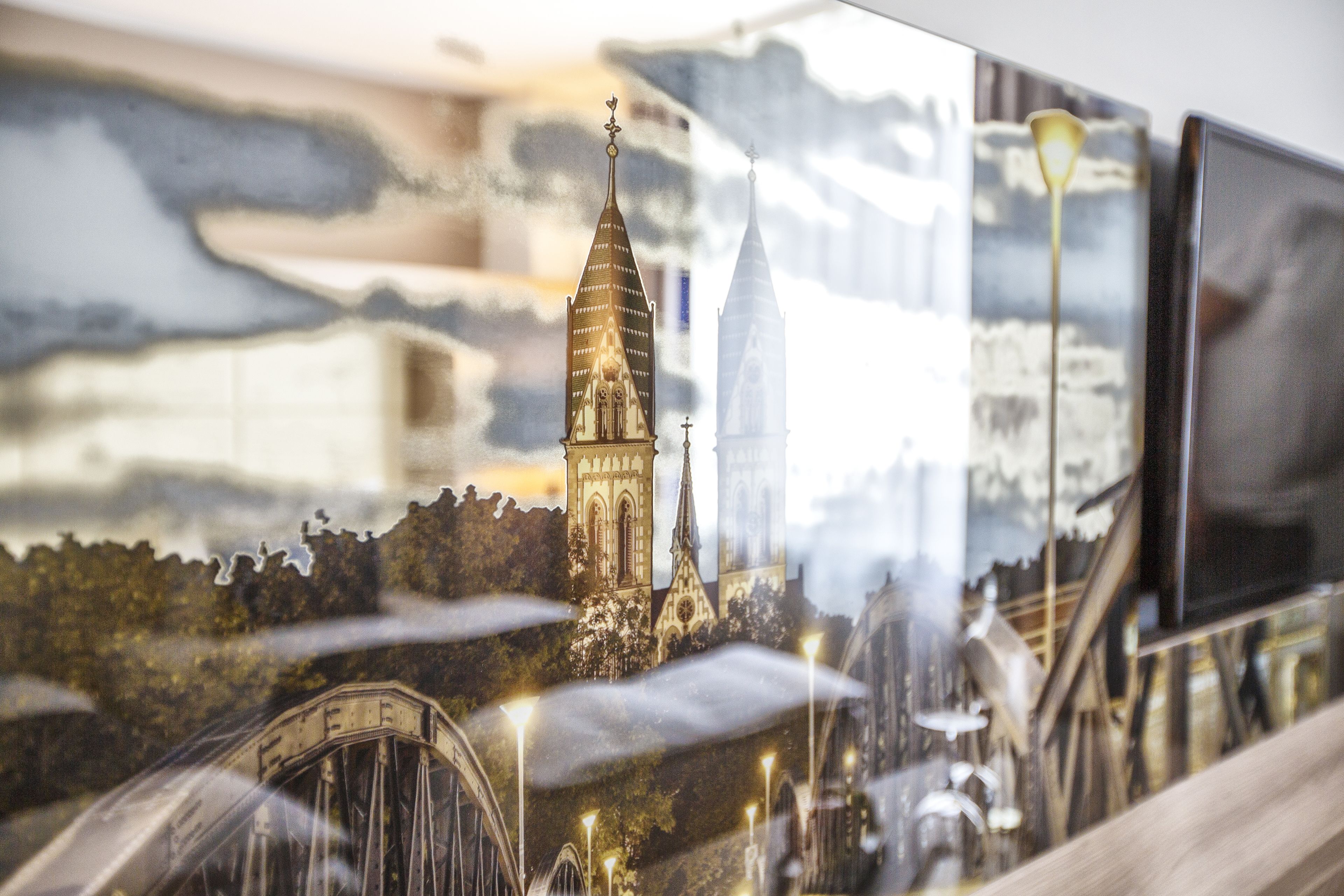 A detailed architectural model of a cityscape with prominent buildings and bridges.