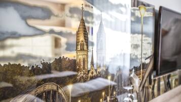 A detailed architectural model of a cityscape with prominent buildings and bridges.