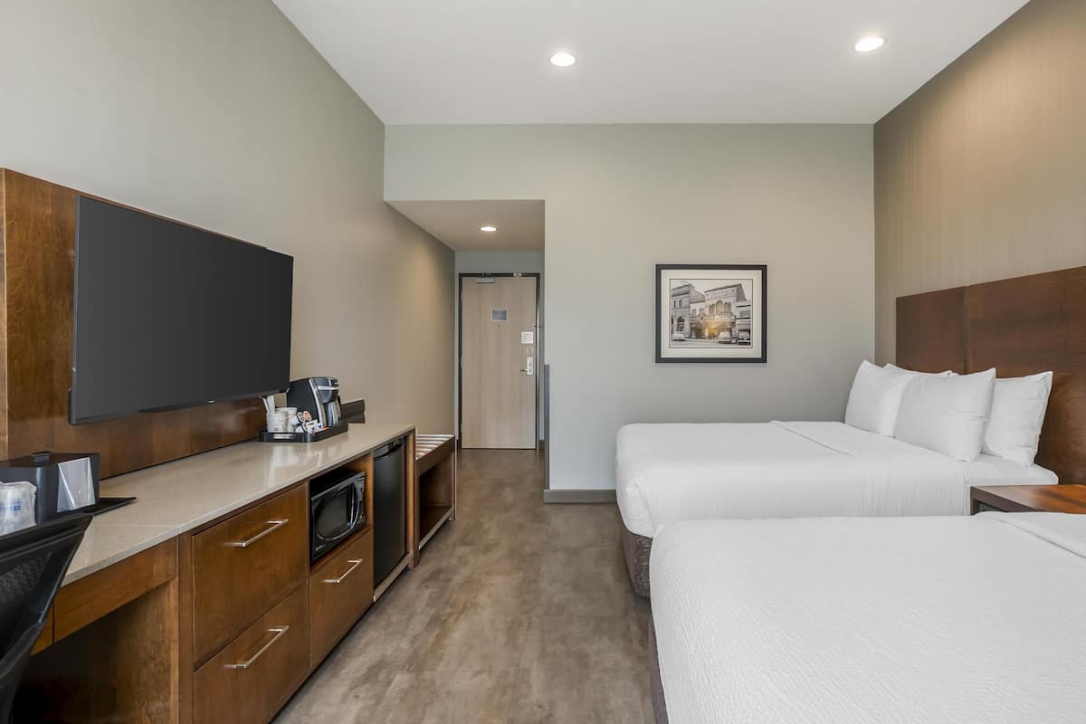 Standard Room, 2 Queen Beds, Non Smoking (Shower Only) | In-room safe, desk, laptop workspace, blackout drapes