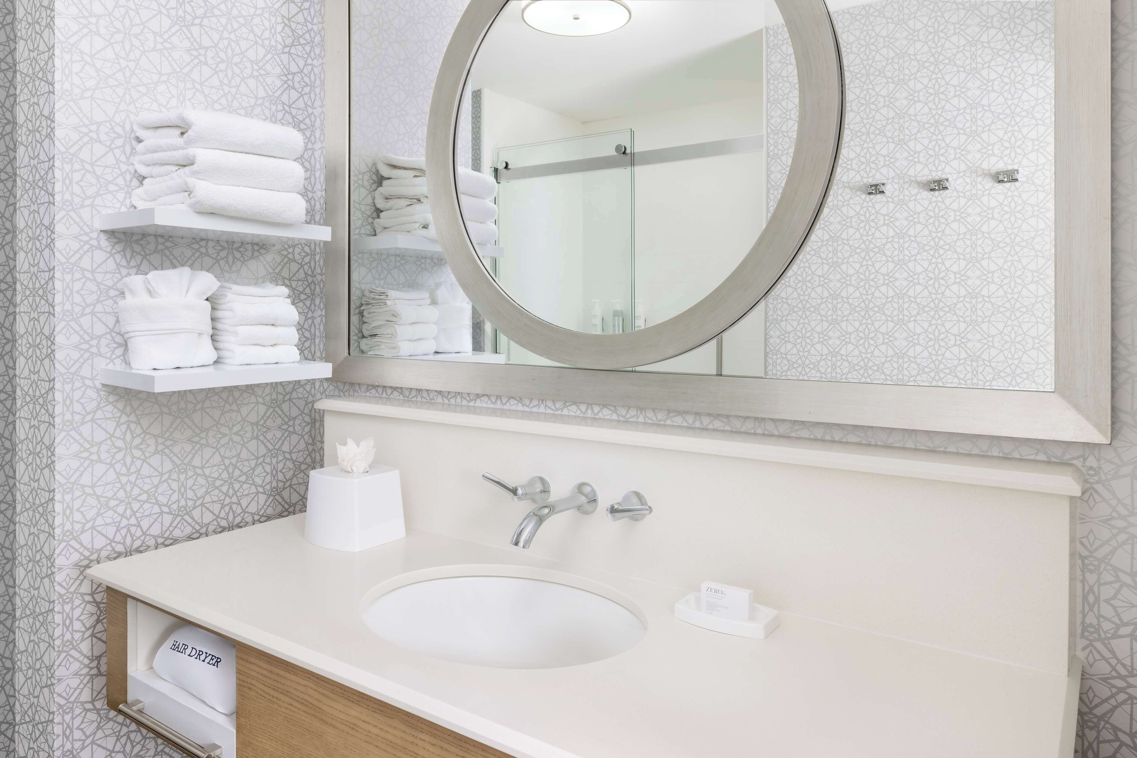 eco-friendly toiletries, hair dryer, towels