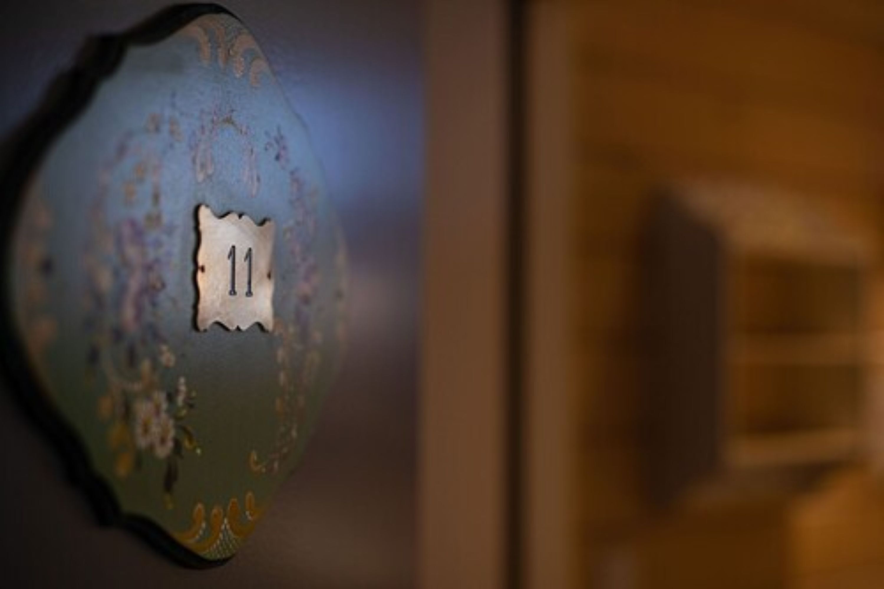 A close-up of a door with a number "11" on it.