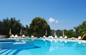 Seasonal outdoor pool, open 8 AM to 8 PM, pool umbrellas, sun loungers