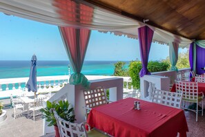 Breakfast, lunch, dinner served; local cuisine  - Blue Lagoon Beach Studio At Montego Club Resort (Montego Bay)