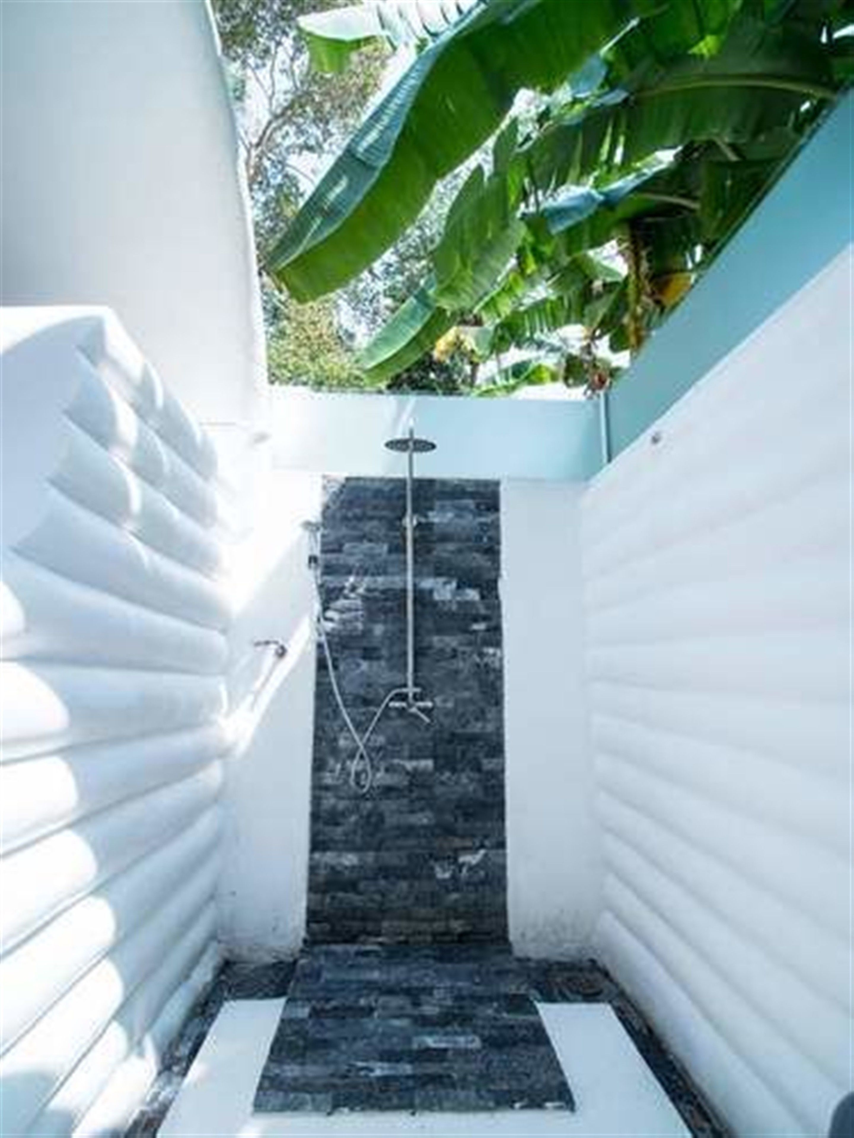 deluxe room, 1 king bed | bathroom | shower, hair dryer, bathrobes, slippers