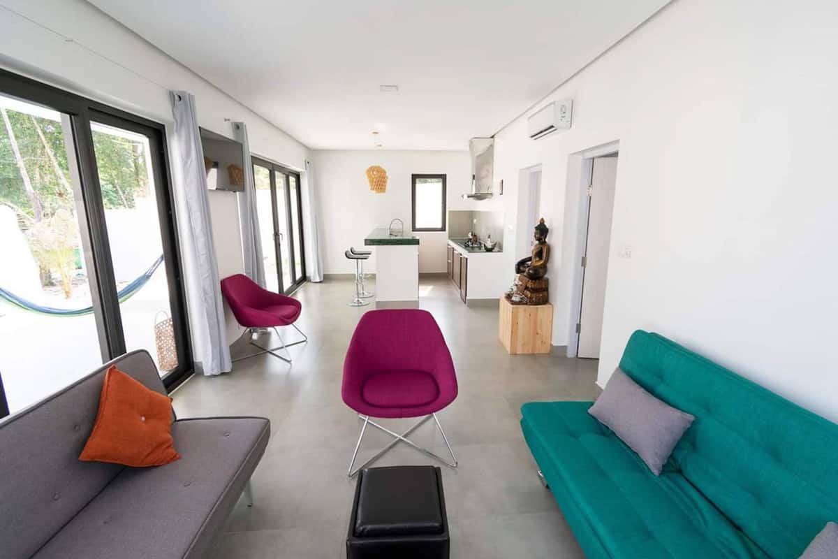 family villa with private jacuzzi (2 king beds and 4 single beds and 1 living room with sofa bed) | living room | flat-screen tv