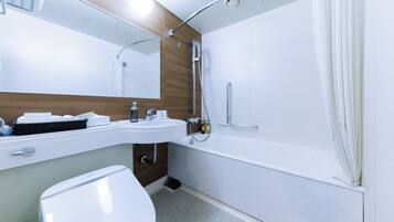Combined shower/tub, free toiletries, hair dryer, slippers