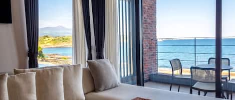 Twin Room, 2 Double Beds | Living area | Flat-screen TV