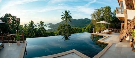 Outdoor pool, pool umbrellas, sun loungers