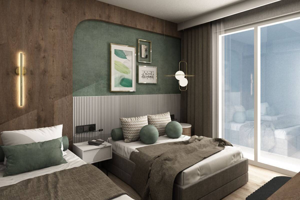 A modern bedroom with a large bed, bedside tables, a green accent wall, and a large window.