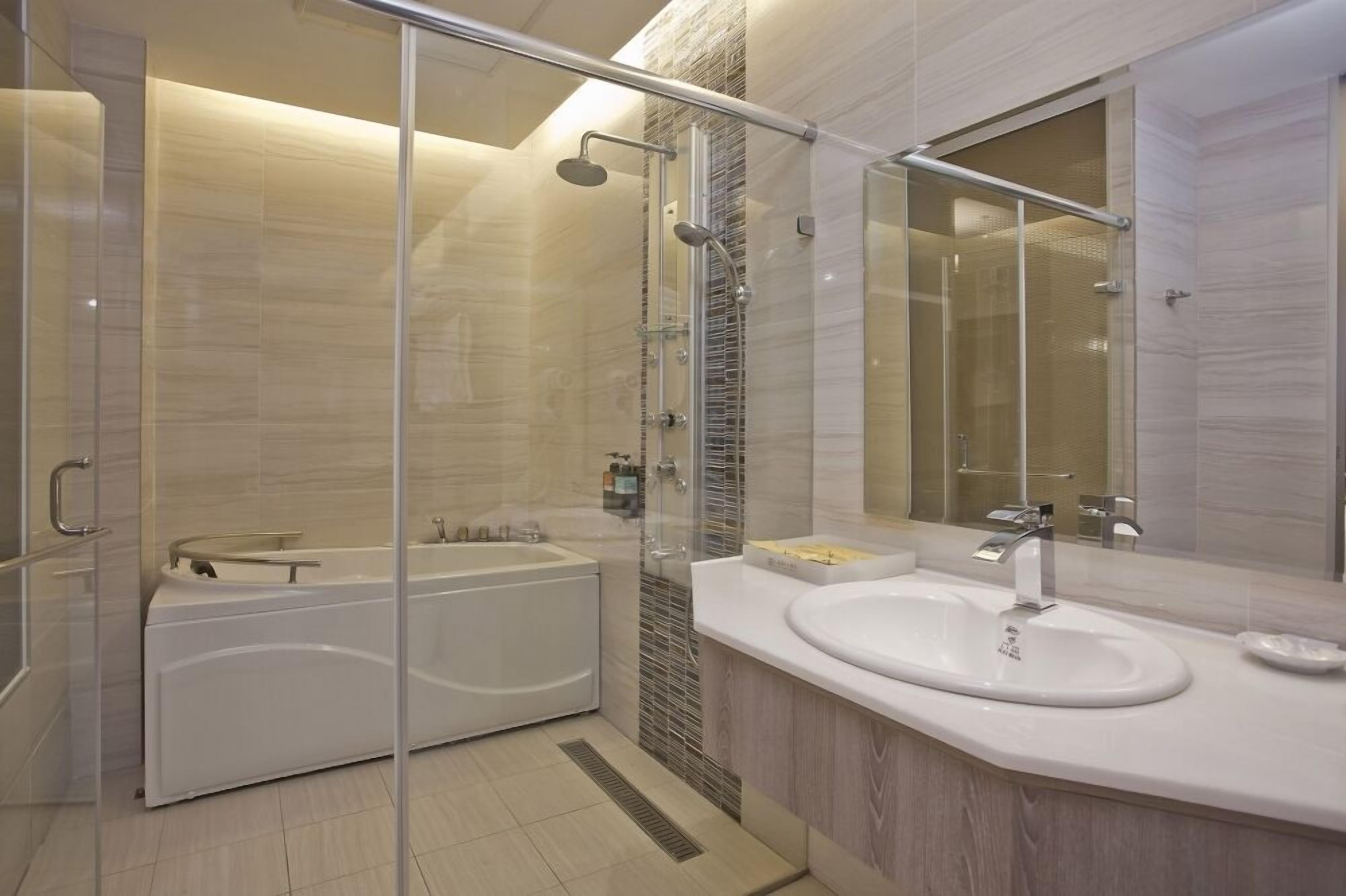 lake view deluxe quadruple room | bathroom | hair dryer, slippers, towels, soap