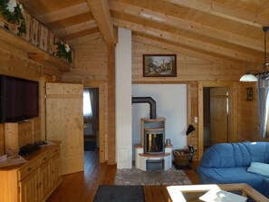 Superior Chalet, 2 Bedrooms | Living area | Flat-screen TV, fireplace, DVD player - Chalets Gröbming (Groebming)
