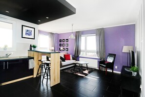 Deluxe Apartment | Living area | TV