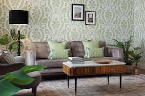 Ashe Suite | Living area | Flat-screen TV