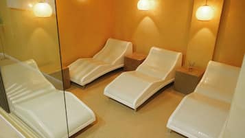 Relax in comfort with three reclining chairs and a mirror reflecting the room's interior.