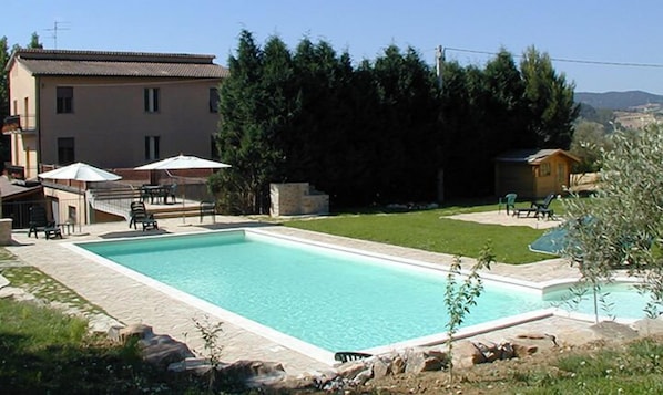 Seasonal outdoor pool, pool loungers