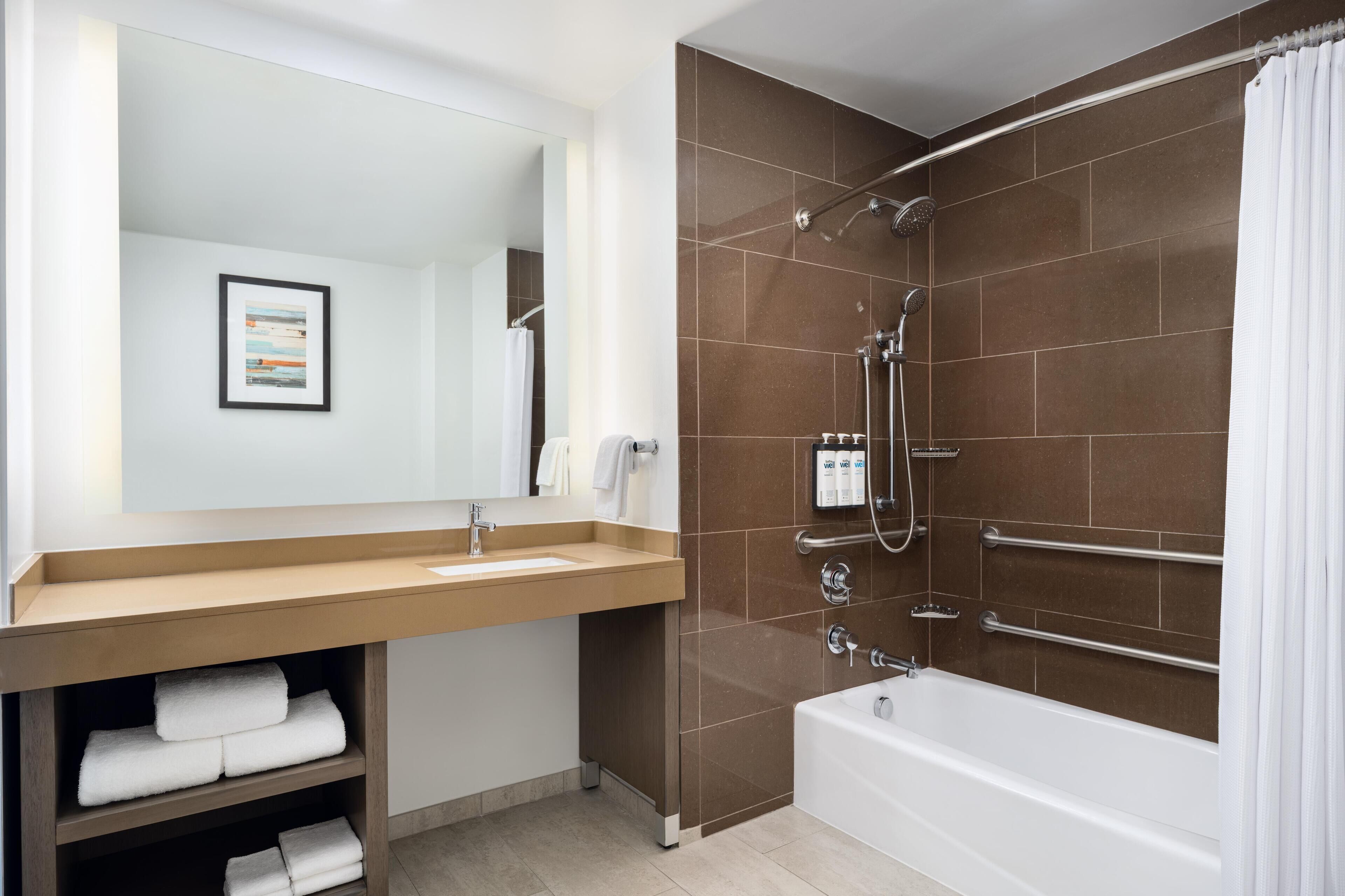 Designer toiletries, hair dryer, towels