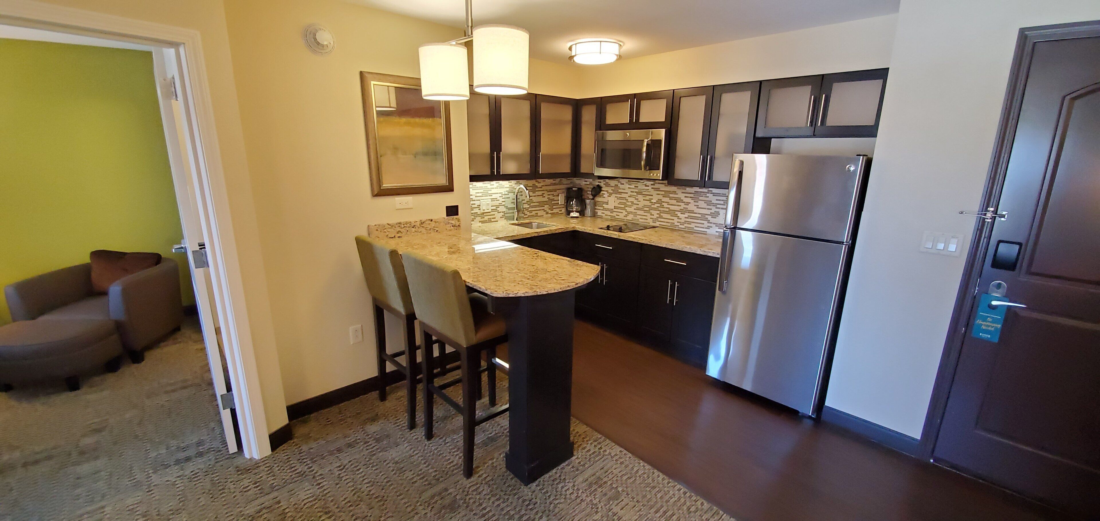 Premium bedding, desk, laptop workspace, blackout drapes