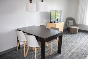 Premium bedding, laptop workspace, iron/ironing board