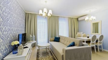 Exclusive Apartment, 1 Bedroom | Living room | 40-inch LCD TV with satellite channels, TV