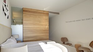 A modern bedroom with a wooden headboard, a bed with white linens, a bedside table with a lamp, and a wall-mounted shelf. - Trossos del Priorat (Gratallops)