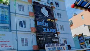 A hotel building with a large sign for 'Bien Xanh' and 'Blue Sea 2'. - Blue Sea 2 Hotel (Bac Nha Trang)