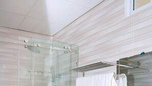 A modern bathroom with a glass-enclosed shower, a white sink, and a toilet. - Blue Sea 2 Hotel (Bac Nha Trang)