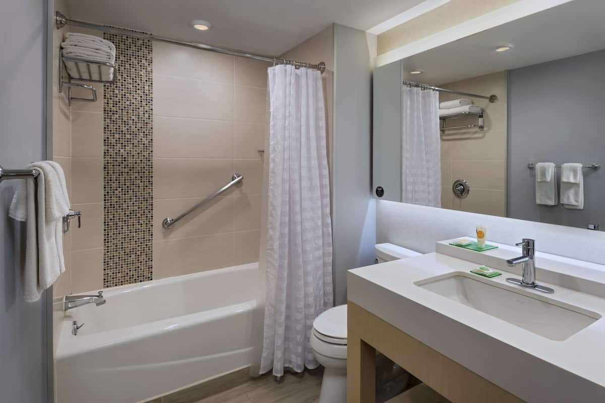 room, 1 king bed | bathroom | shower, designer toiletries, hair dryer, towels